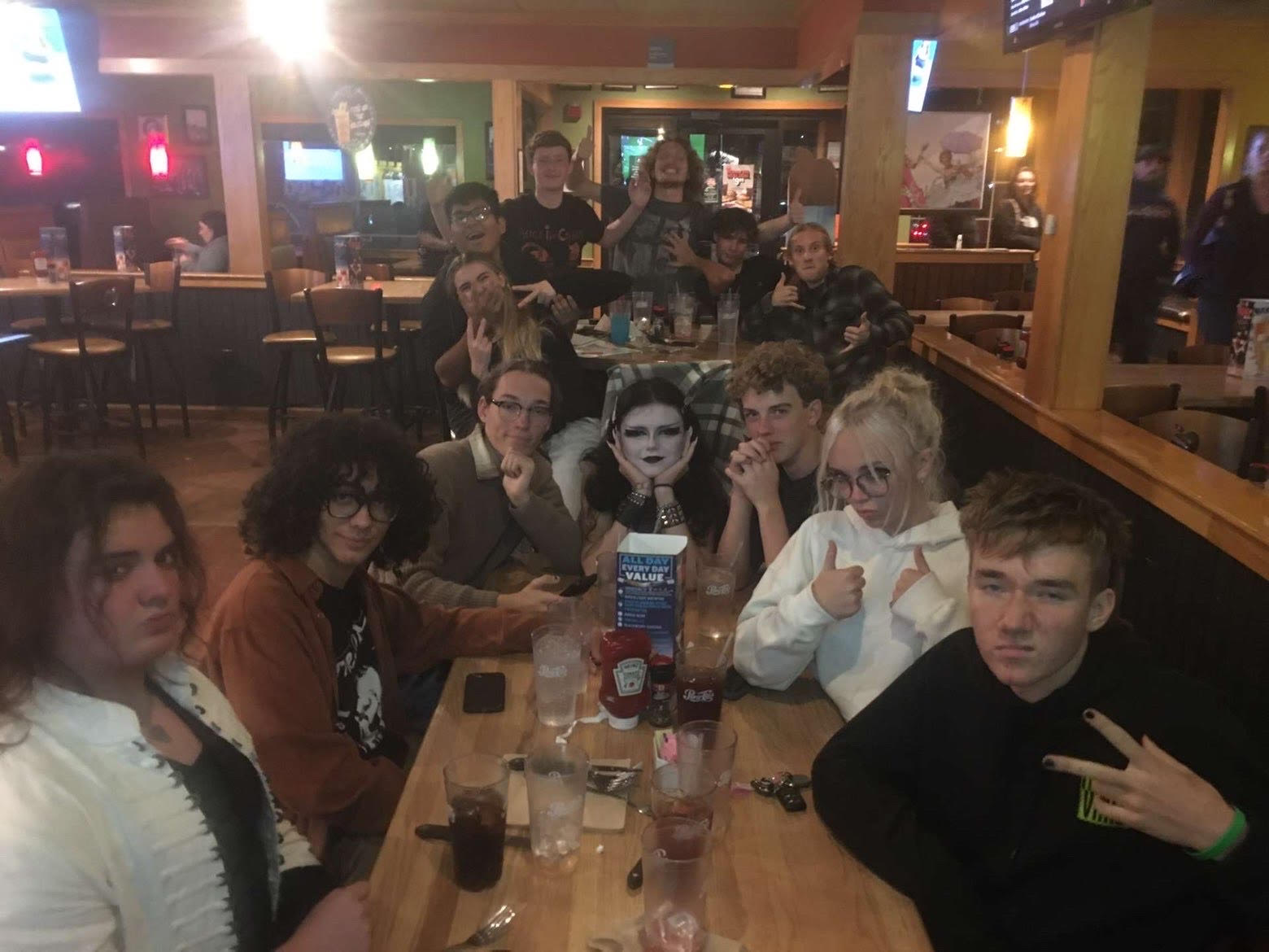 The band members sitting at a table